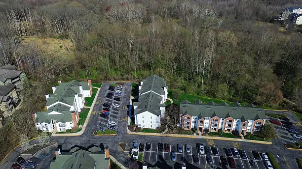 Drone aerial photography of apartment building and parking lot in Newark DE by Pixiest Photography